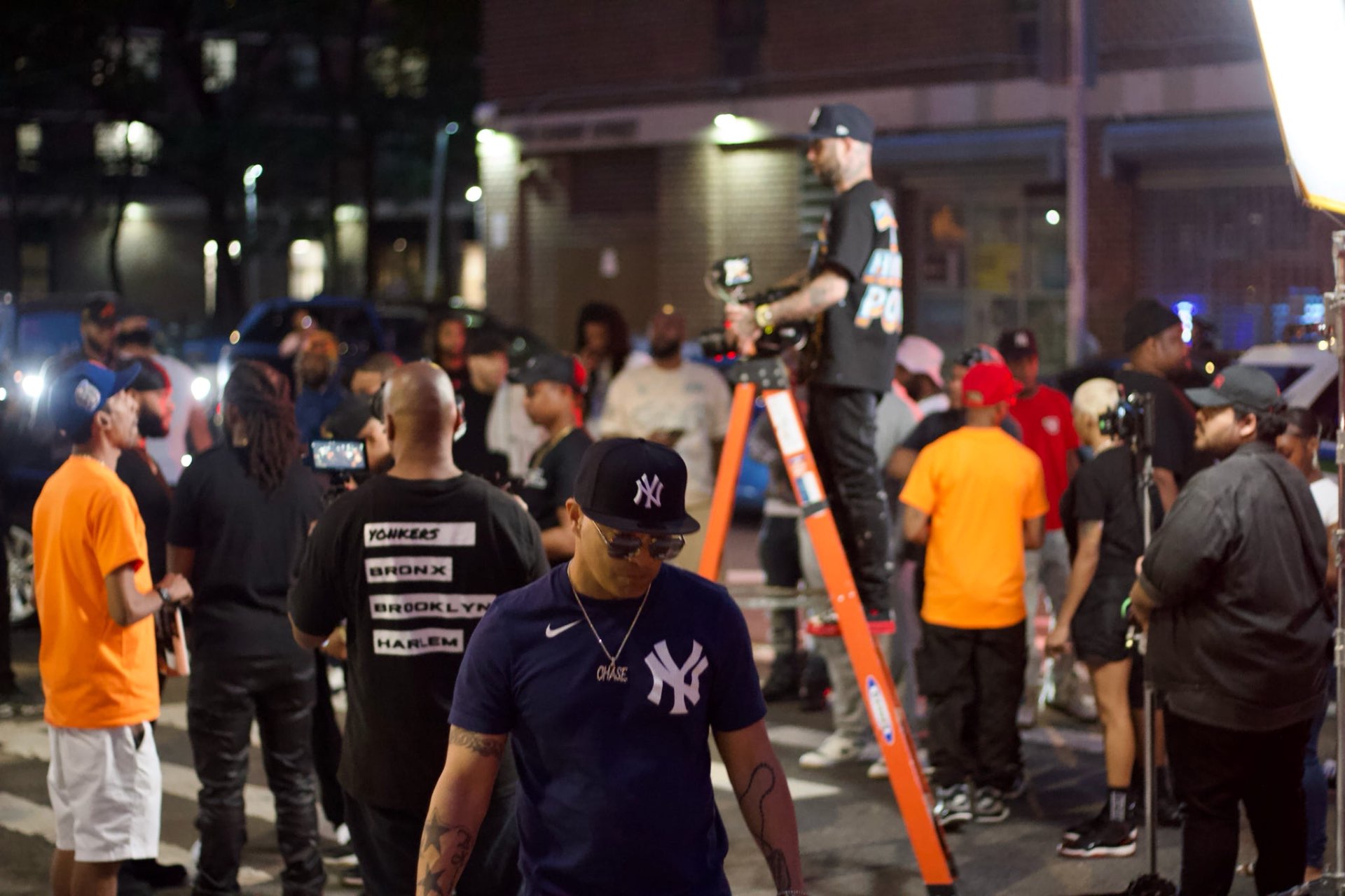 Night exterior — full crew at work